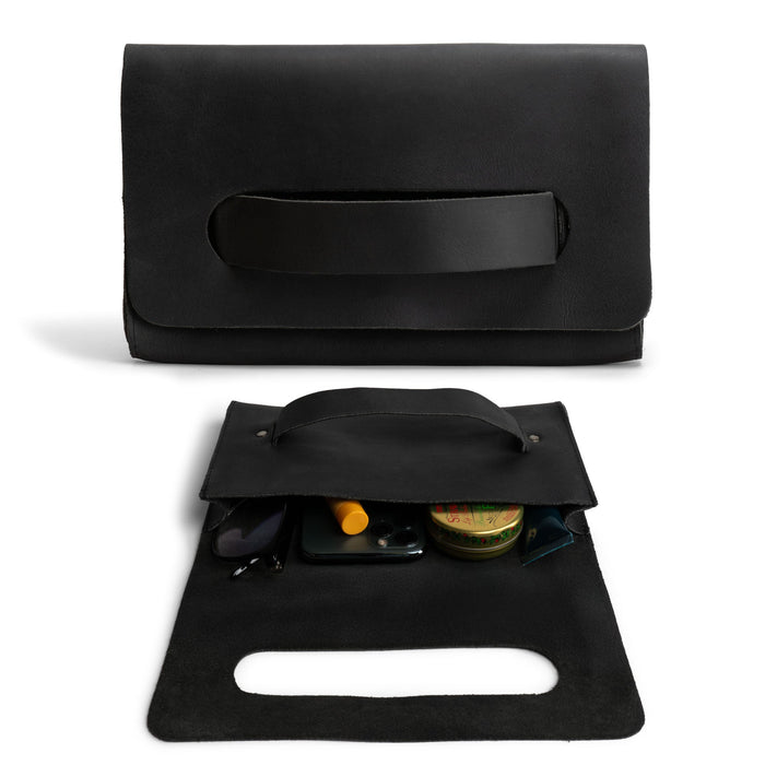 Elegant black Clutch Bag With Handle by Hide & Drink, ideal for women as a handbag or night bag. Made from durable Full Grain Leather, this artisan product features small batch production, handmade in La Antigua Guatemala & Oaxaca Mexico.