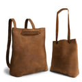 A stylish Convertible Backpack to Shoulder Bag by Heather's, showcasing its versatile design. This squared purse is made from high-quality Full Grain Leather, perfect for women seeking a spacious crossbody. Hand crafted through small batch production, this bag features hand cut, hand sewn, and fire branded details, reflecting the artisan craftsmanship from La Antigua Guatemala & Oaxaca Mexico.
