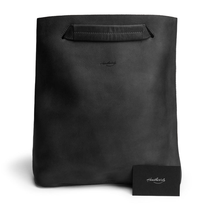 Front view of Heather's Convertible Backpack to Shoulder Bag in black, showcasing its elegant and functional design. Made from Full Grain Leather, this spacious crossbody for women is a perfect combination of style and practicality, representing artisan craftsmanship from La Antigua Guatemala & Oaxaca Mexico.