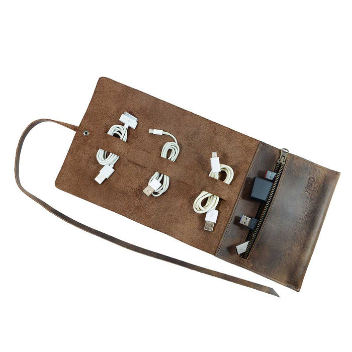 Hide & Drink Cord Pouch, an artisan handmade travel bag made of full grain leather, features multiple slots for organizing cables, making it an ideal cord wrap and cable holder. Small batch production crafted by skilled artisans in La Antigua Guatemala & Oaxaca Mexico.