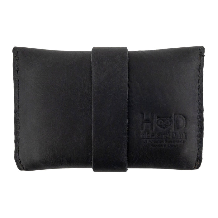 Back view of Hide & Drink's black Credit Card Holder emphasizing craftsmanship and quality. Designed for everyday use, this Full Grain Leather wallet is hand sewn and perfect for those looking for a stylish and minimalist front pocket solution.
