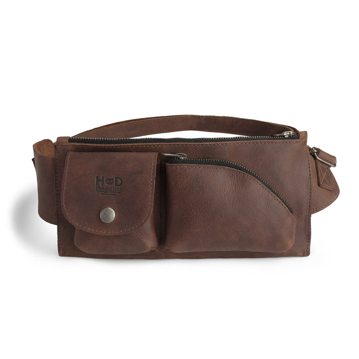 Crossbody Multi-Pocket Bag by Hide & Drink showcasing a stylish design in dark full grain leather. This versatile Crossbody Bag can be used as a Messenger Bag or Shoulder Bag, perfect as a Travel Accessory. The craftsmanship is evident with its hand cut and hand sewn details, making it a true artisan piece from small batch production in La Antigua Guatemala & Oaxaca Mexico.