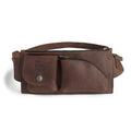 Crossbody Multi-Pocket Bag by Hide & Drink showcasing a stylish design in dark full grain leather. This versatile Crossbody Bag can be used as a Messenger Bag or Shoulder Bag, perfect as a Travel Accessory. The craftsmanship is evident with its hand cut and hand sewn details, making it a true artisan piece from small batch production in La Antigua Guatemala & Oaxaca Mexico.