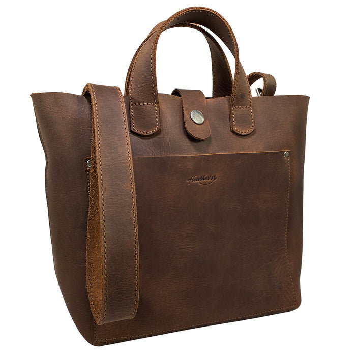 Heather's Crossbody Tote Bag with Pouch, showcasing a rustic handbag made from full grain leather, designed in a vintage style shoulder case, perfect for travel and shopping. This artisan piece is handmade in La Antigua Guatemala & Oaxaca Mexico, featuring small batch production with hand cut and hand sewn details.