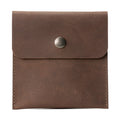 Hide & Ride Document Handlebar Bag made of full grain leather, showcasing a compact design suitable for motorcycle handlebars. This Motorcycle Document Bag is a perfect small bag for handlebar storage and essential biker accessories, emphasizing artisan craftsmanship from StockyardX with small batch production.