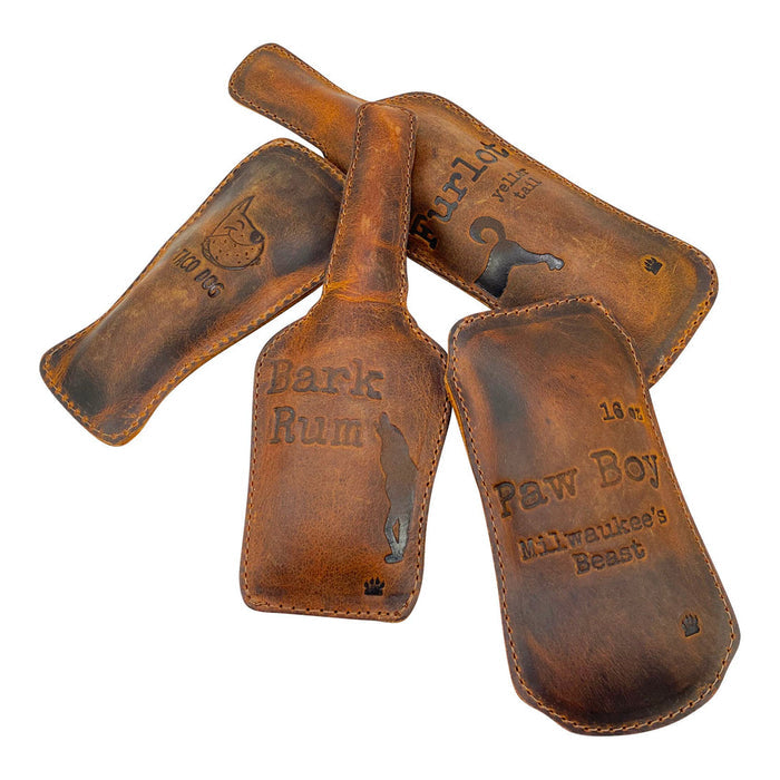 Taco Dog Dog Chew Toys (4 Pieces) displaying the stylish designs of Paw Boy, Furlot, Bark Rum, and Irish Snout. Made from durable full grain leather, these handmade artisan toys are perfect for small breeds and active chewers, showcasing quality craftsmanship.