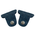 Two navy blue Dog Cord Keepers by Taco Dog, perfect for wrapping your cables and keeping them organized. Made from full grain leather, these handmade accessories feature clip snaps for easy travel management. Enjoy the artisan craftsmanship of La Antigua Guatemala with this charming duo.