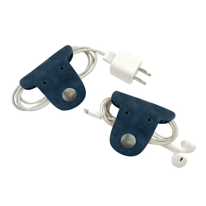 Manage your headphones and chargers in style with Taco Dog's navy blue Dog Cord Keepers. Crafted from premium full grain leather, these handmade accessories clip securely for effortless organization during travel. Experience artisan quality from La Antigua Guatemala with this 2 pack.