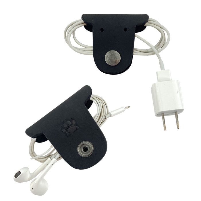 Keep your cords neat with Taco Dog's Dog Cord Keepers, featuring a unique design to manage headphones and chargers. Made from full grain leather, these handmade pieces offer both function and style for travel. Enjoy artisanal craftsmanship from La Antigua Guatemala with this 2 pack.