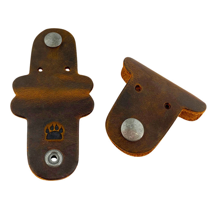 Taco Dog's Dog Cord Keeper offers a stylish solution for organizing your cables and chargers. Made of full grain leather, these handmade cord management accessories are perfect for traveling. Enjoy small batch artisan quality from La Antigua Guatemala with each charming piece in this 2 pack.