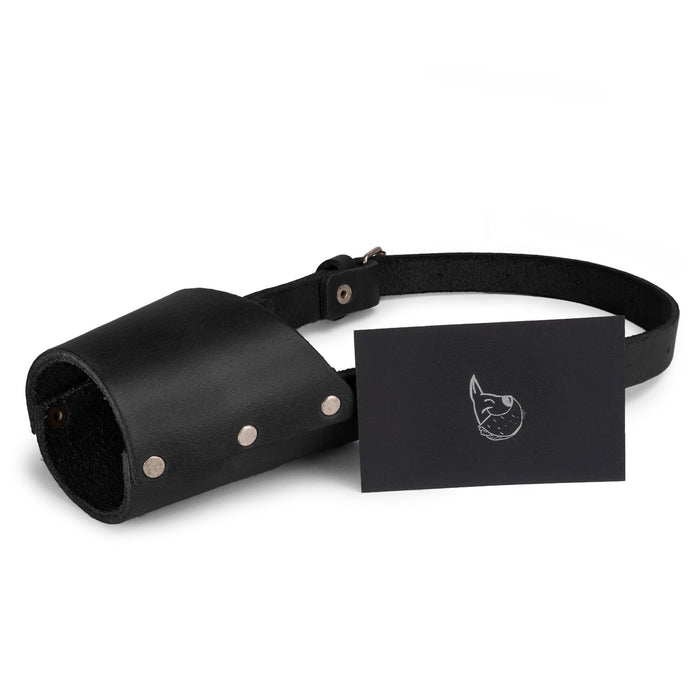 Taco Dog Dog Muzzle shown in detail, highlighting its sturdy construction from full grain leather. This handcrafted muzzle secures your dog's mouth while preventing unwanted behavior.