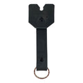 Front view of a black Taco Dog Doggy Fob Keychain, showcasing its design and functionality. This handmade accessory made from full grain leather is both durable and lightweight, ideal for dog lovers seeking practical gifts with artisan quality from La Antigua Guatemala.