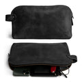 Dopp Kit Utility Bag by Hide & Drink showcasing its rich tones and artisan details. This artisan-crafted Dopp Kit Utility Bag serves as a perfect travel companion, made from premium full grain leather with emphasis on hand cut and hand sewn craftsmanship, handmade in La Antigua Guatemala & Oaxaca Mexico.