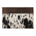 Western Leather Works Double Card Wallet featuring beautifully crafted hair-on-hide full grain leather. This Minimalist Rodeo Wallet offers compact storage, ideal as an ID holder or travel accessory. Handmade in La Antigua Guatemala with a focus on small batch production, hand cut and hand sewn techniques. A fire branded artisan product that combines style with functionality.