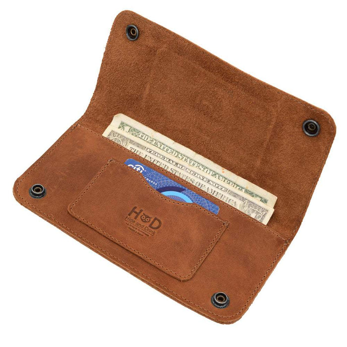 Card slot detail in the Brown Double Snap Folio Wallet by Hide & Drink, underscoring its meticulous craftsmanship. This wallet made of full grain leather excels as a rectangular flat bill holder with card slot, combining beauty with function for night bag and travel accessory, crafted in La Antigua Guatemala & Oaxaca Mexico.