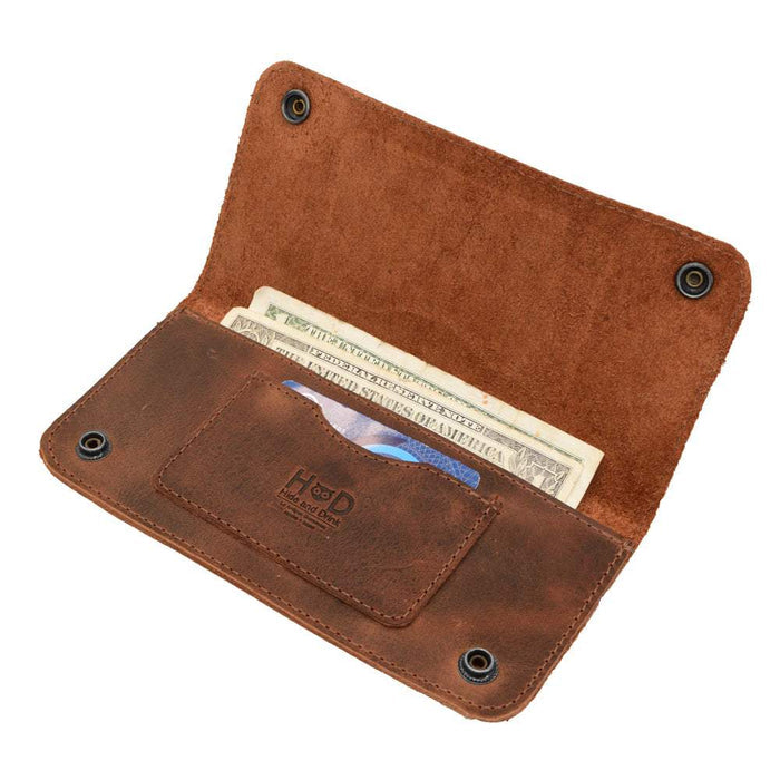 Open view of the Brown Double Snap Folio Wallet by Hide & Drink, revealing its practical design for holding cash and cards. This full grain leather wallet acts as a rectangular flat bill holder with card slot, an ideal night bag and travel accessory. Hand crafted in La Antigua Guatemala & Oaxaca Mexico, showcasing the dedication of small batch production.