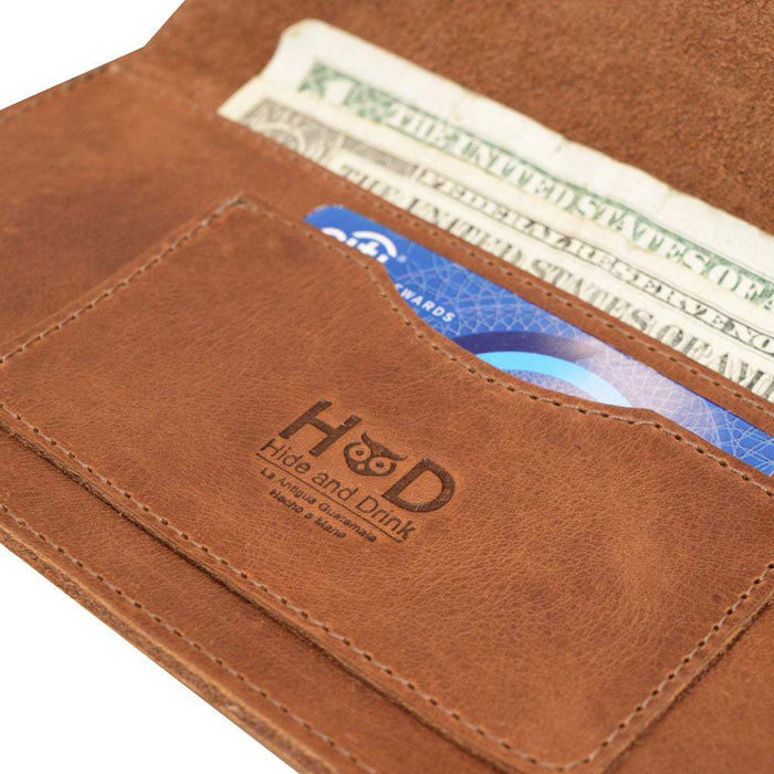 Business card holder section of the Brown Double Snap Folio Wallet by Hide & Drink, highlighting its design for organization. Made from full grain leather, this rectangular flat bill holder with card slot is a refined night bag and travel accessory, showcasing artisanship from La Antigua Guatemala & Oaxaca Mexico.