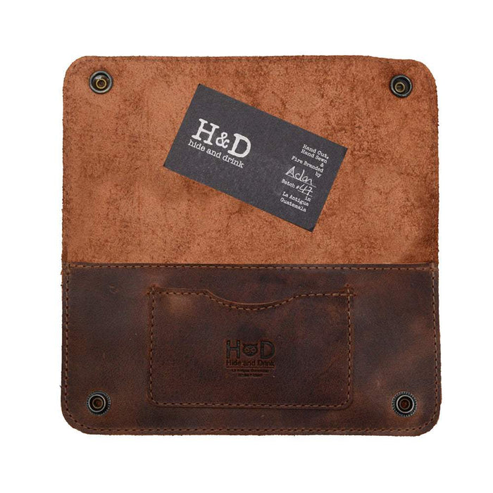 Inside view of the Brown Double Snap Folio Wallet by Hide & Drink showing a business card holder and cash slot. This elegant accessory, made from full grain leather, is perfect as a night bag or travel accessory. Artisan crafted in La Antigua Guatemala & Oaxaca Mexico, highlighting the charm of small batch production.