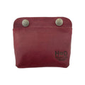 Front view of Hide & Drink Double Snap Pouch in vibrant green leather, perfect for cash and coins. This full grain leather pouch reflects artisan craftsmanship from La Antigua Guatemala.
