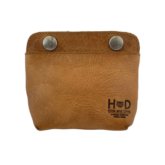 Front view of Hide & Drink's Double Snap Pouch in soft tan leather, showcasing its utility as a coin purse and cash & card holder. This artisan-crafted full grain leather product is made in La Antigua Guatemala.