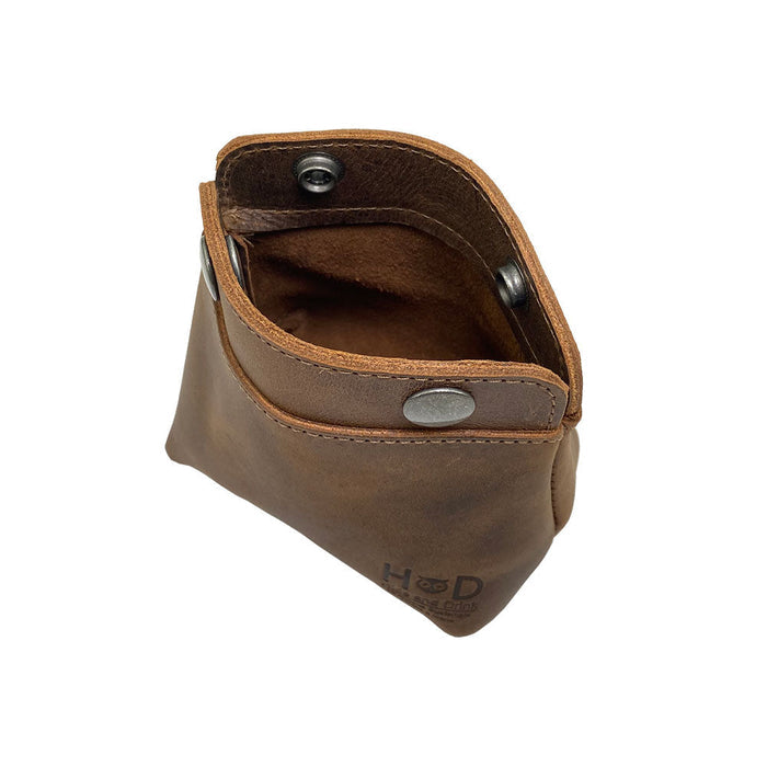 Interior view of the Hide & Drink Double Snap Pouch, designed as a functional coin purse and cash holder, made from full grain leather. Hand cut and sewn by artisans in La Antigua Guatemala, it's perfect for small items like cables or makeup.