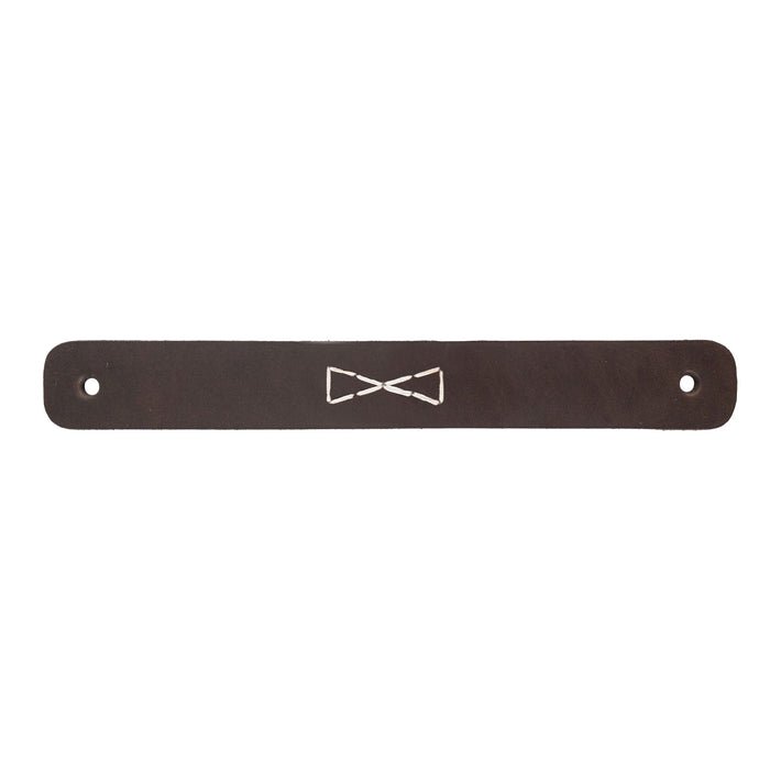 Close-up of a single Rectangular Drawer Handle with Bowtie Stitching Design, made from quality full grain leather by Hide & Drink. This handmade handle is part of the unique 4 Pack collection, emphasizing artisan techniques from La Antigua Guatemala & Oaxaca Mexico.