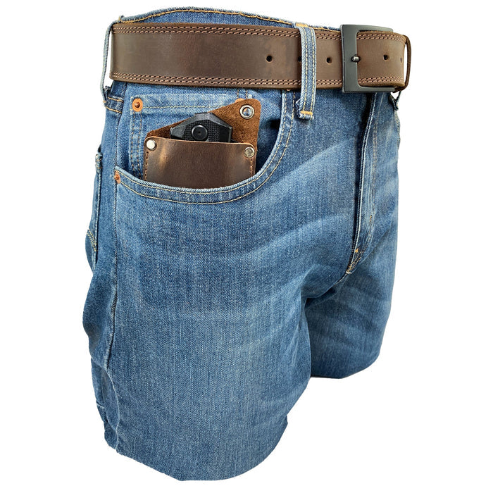 Valhalla Gear EDC Knife Sheath shown in a pocket of jeans, made from full grain leather and designed as a rectangular knife sheath. This vertical holster is a convenient multitool holder that enhances your camping and outdoor accessories. Artisan crafted in La Antigua Guatemala, featuring hand cut, hand sewn quality.