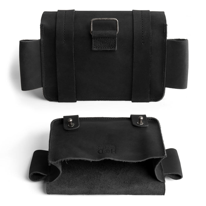 The back view of Hide & Drink's black Empty First Aid Bag, Mini Medical Storage Pouch, highlighting its sleek and functional design. This Empty First Aid Bag is a compact container for medical kits, showcasing hand sewn craftsmanship and artisan quality from small batch production in La Antigua Guatemala.