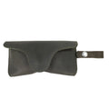 Dark Green Eyeglasses Case with Strap by Hide & Drink, featuring a chic design. Made from full grain leather, this sunglasses case acts as a durable protector for eyewear, reflecting small batch production by artisans in La Antigua Guatemala & Oaxaca Mexico.