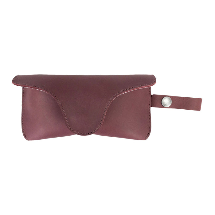 Rich Burgundy Eyeglasses Case with Strap by Hide & Drink, designed for stylish functionality. Crafted from full grain leather, this sunglasses case is a reliable protector for eyewear, symbolizing artisan craftsmanship in La Antigua Guatemala & Oaxaca Mexico.