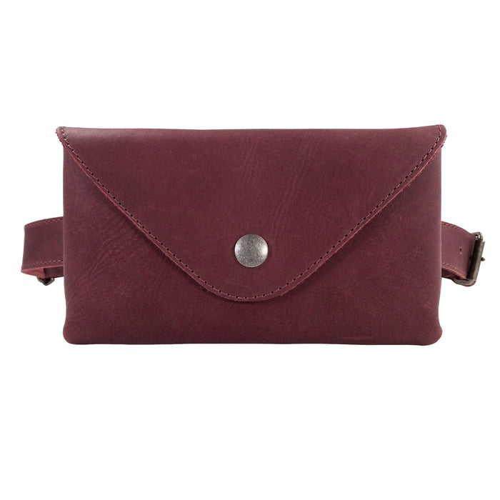 The Fancy Fanny Pack in rustic brown by Hide & Drink, showcasing its sturdy leather construction. Ideal as a fanny pack and phone holder, this artisan piece is handcrafted in small batches in La Antigua Guatemala.