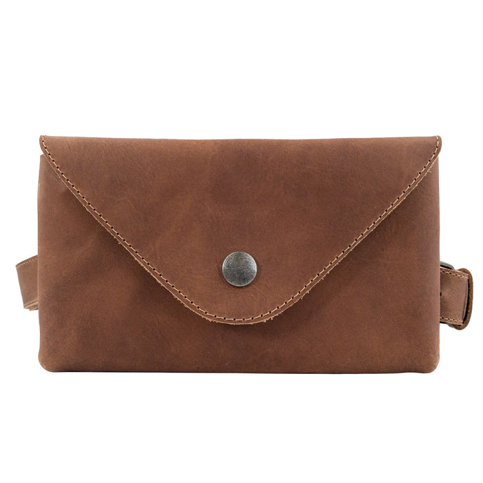 Front view of the Fancy Fanny Pack in a luxurious brown hue by Hide & Drink. This waist pouch is designed for convenience and style, made from quality full grain leather, perfect as a vintage purse and suitable for easy travel for digital nomads.