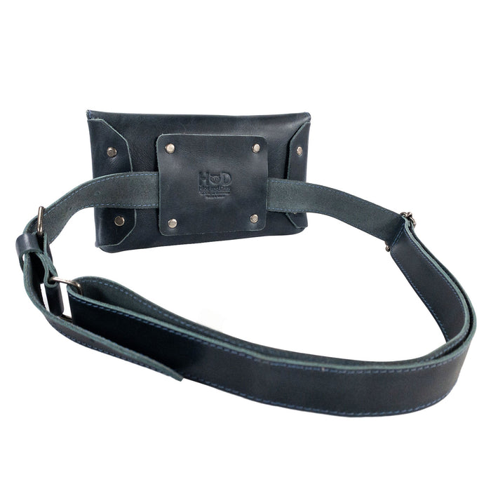 Hide & Drink’s glossy black Fancy Fanny Pack demonstrating superior craftsmanship. This full grain leather waist pouch is perfect for multitasking as both a medieval bag and stylish fanny pack.