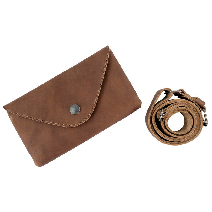 Hide & Drink's Fancy Fanny Pack displayed with its adjustable strap, emphasizing versatility. Crafted from sturdy full grain leather, this waist pouch is perfect for easy travel for digital nomads and doubles as a vintage purse.