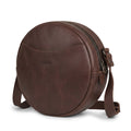 Heather's Female Rounded Crossbody Hand Bag made of Full Grain Leather, featuring a stylish design perfect for any occasion. This Rounded Crossbody bag for women is a zippered handbag that combines fashion and functionality. Handmade in La Antigua Guatemala, it showcases small batch production with hand cut and hand sewn details, proudly fire branded by artisans.