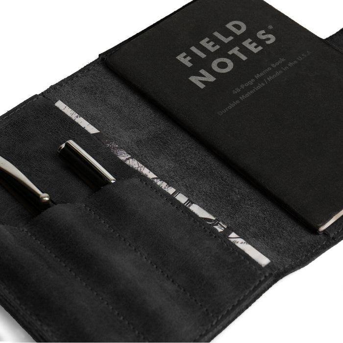 Close-up of Leather Worx Field Notes Cover 3.5 x 5.5 in. Cover with Pen Slots in black, highlighting the craftsmanship. This stylish Full Grain Leather Cover for Field Notes (3.5 x 5.5 in.) is perfect as a notebook case or sleeve. Artisan-made in La Antigua Guatemala and Oaxaca Mexico, it showcases dedication to quality.