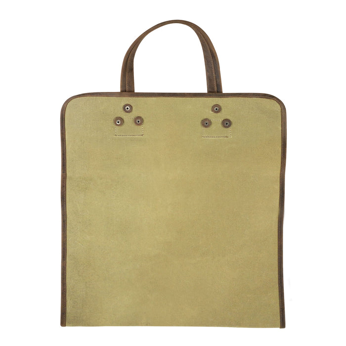 Hide & Drink Firewood Bag displayed from the front, showcasing its robust design and leather detailing, perfect for adding a rustic touch to any home. Firewood Bag With Leather Liner, Full Grain Leather, StockyardX, Small Batch Production, Hand Cut, Hand Sewn, Fire Branded, Artisan, Handmade in La Antigua Guatemala & Oaxaca Mexico.