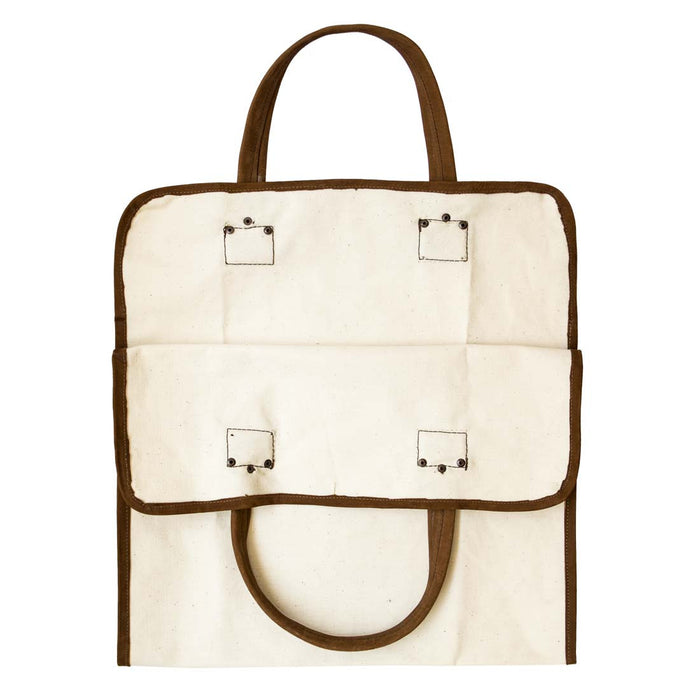 Hide & Drink Firewood Bag displayed flat with a focus on its quality stitching and leather details, showcasing the handmade artistry. Firewood Bag With Leather Liner, Full Grain Leather, StockyardX, Small Batch Production, Hand Cut, Hand Sewn, Fire Branded, Artisan, Handmade in La Antigua Guatemala & Oaxaca Mexico.