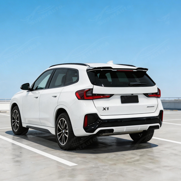 Full rear 3/4 view of a 2024 BMW X1 xDrive28i featuring the gloss black roof spoiler kit