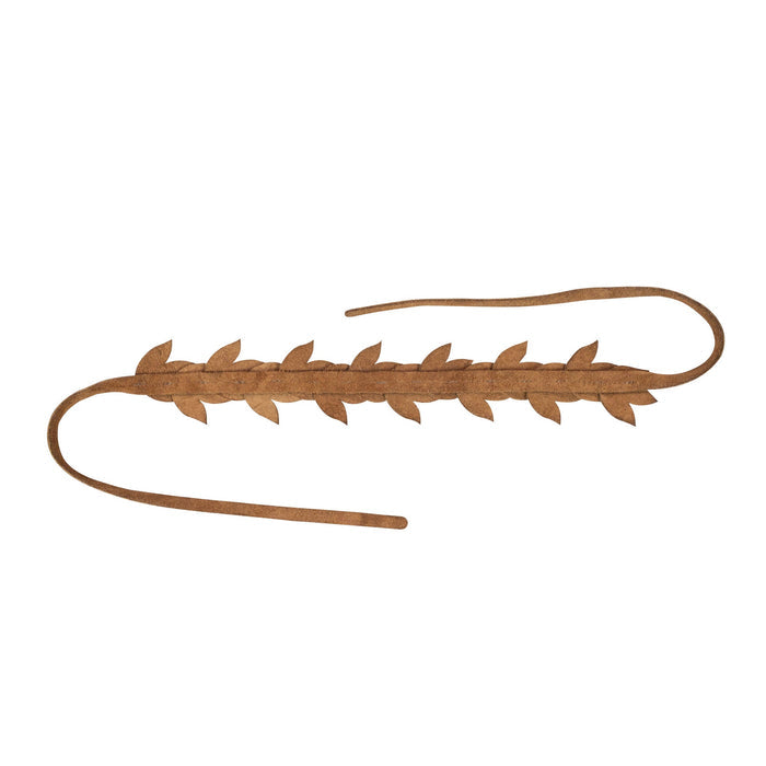 An overhead shot of Heather's Flowered Headband, this rustic hairpiece highlights its unique leather craftsmanship. Designed for women, this flower crown made of full grain leather is perfect for adding charm to any look. It represents small batch production and the skill of artisans from La Antigua Guatemala.