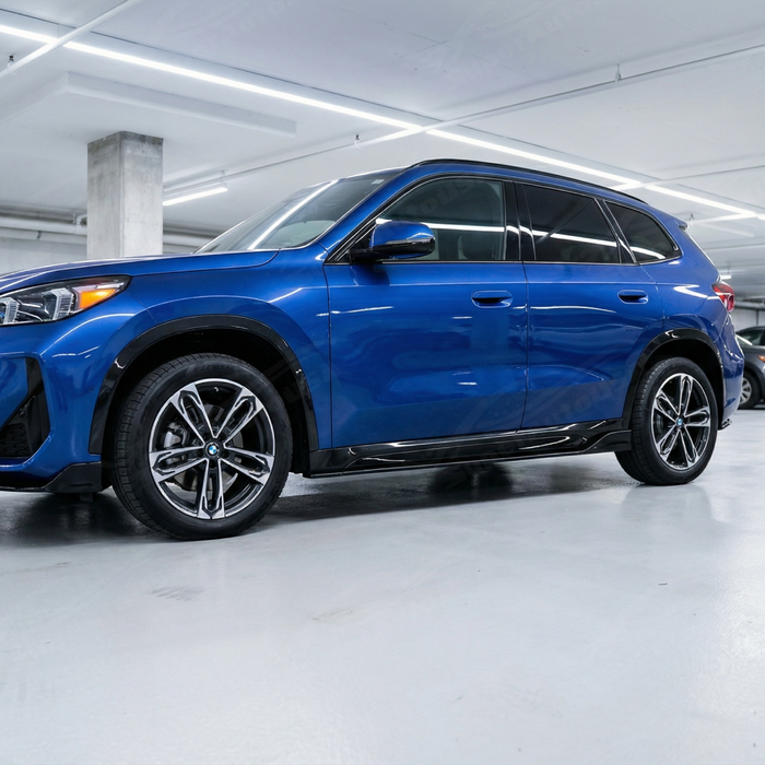 Close-up of the mirror-like gloss black finish on the BMW X1 side rocker extensions