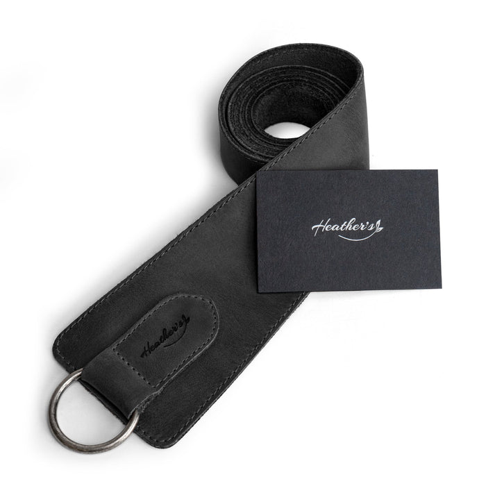 Heather's Formal Belt for Women with Ring in black, elegantly rolled for display. This No-Buckle Belt made of Full Grain Leather represents the artisan work of small batch craftsmanship, hand cut and sewn in La Antigua Guatemala.