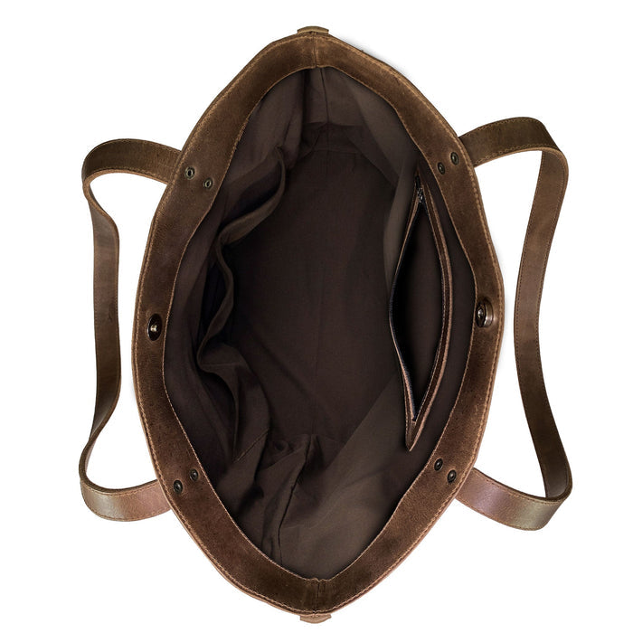 Western Leather Works Formal Tote Bag showcasing its elegant inner side lined with plaid cotton. Crafted from Hair on Hide Full Grain Leather, this bag is spacious and perfect for various uses. Its handmade nature ensures a durable design that embodies artisan quality. Handmade in La Antigua Guatemala & Oaxaca Mexico.