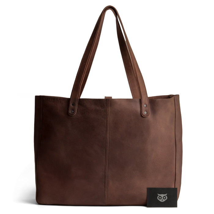 Beautifully handcrafted Formal Tote Bag by Hide & Drink displayed against a white backdrop, emphasizing its elegant design and soft full grain leather texture. This versatile handbag is perfect for women seeking a large shoulder bag for work or casual outings, combining practicality with artisan quality.