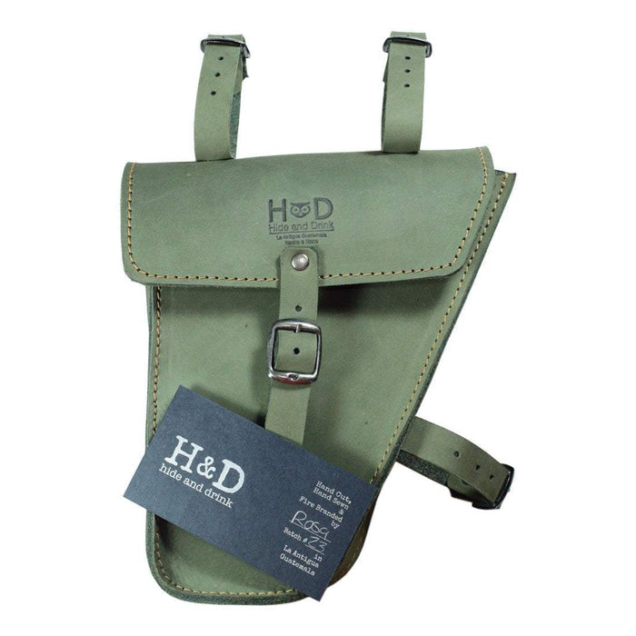 Showcasing Hide & Drink's olive green Frame Bag For Bicycle with a tag, underlining its artisan heritage. This Full Grain Leather bag serves as a durable bike tool pouch, reflecting the skilled craftsmanship from La Antigua Guatemala & Oaxaca Mexico.
