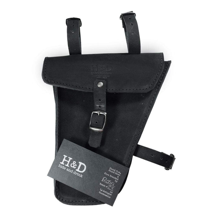 Hide & Drink's black Frame Bag For Bicycle presented with a tag, emphasizing its artisan quality. This Full Grain Leather bike tool pouch is a vital accessory for storing tools, showcasing small batch production and handmade artistry from La Antigua Guatemala & Oaxaca Mexico.