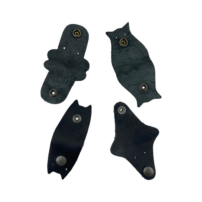 Furry Friends Cord Keeper (4-Pack), featuring delightful animal shapes, expertly crafted from full grain leather by Hide & Drink for stylish cable storage. Furry Friends 4-Pack Cord Keeper (Cord Clam), Full Grain Leather, StockyardX, Small Batch Production, Hand Cut, Hand Sewn, Fire Branded, Artisan, Handmade in La Antigua Guatemala & Oaxaca Mexico.