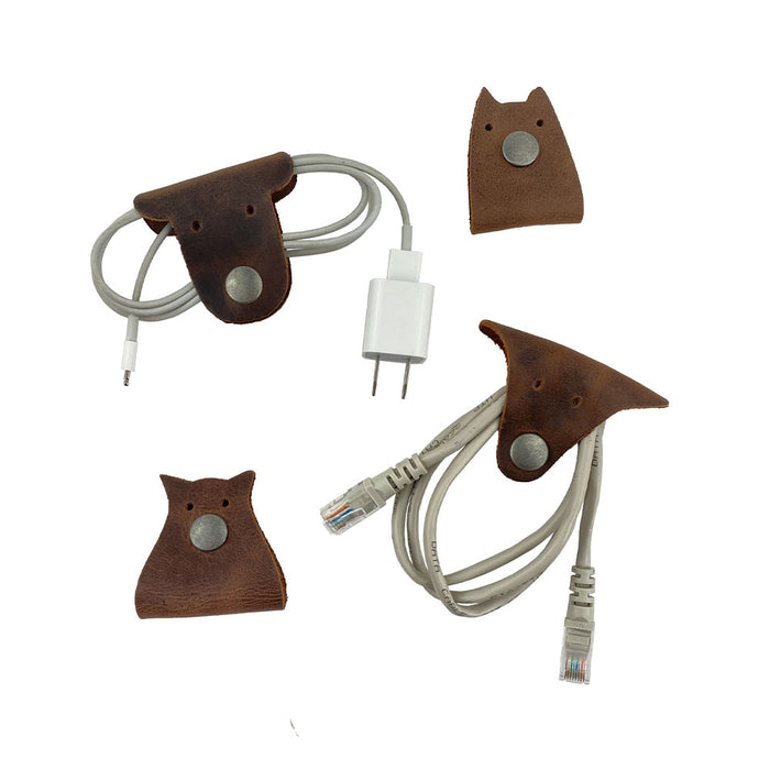 Furry Friends Cord Keeper (4-Pack), showcasing cute designs to organize cables, made from high-quality full grain leather by Hide & Drink. Furry Friends 4-Pack Cord Keeper (Cord Clam), Full Grain Leather, StockyardX, Small Batch Production, Hand Cut, Hand Sewn, Fire Branded, Artisan, Handmade in La Antigua Guatemala & Oaxaca Mexico.