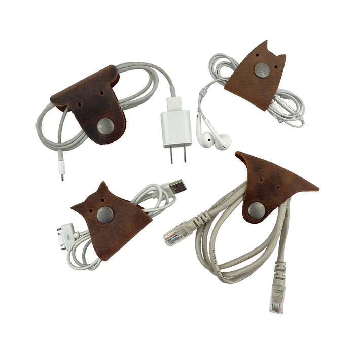 Furry Friends Cord Keeper (4-Pack) featuring adorable animal shapes, created from premium full grain leather by Hide & Drink for effective cable storage. Furry Friends 4-Pack Cord Keeper (Cord Clam), Full Grain Leather, StockyardX, Small Batch Production, Hand Cut, Hand Sewn, Fire Branded, Artisan, Handmade in La Antigua Guatemala & Oaxaca Mexico.