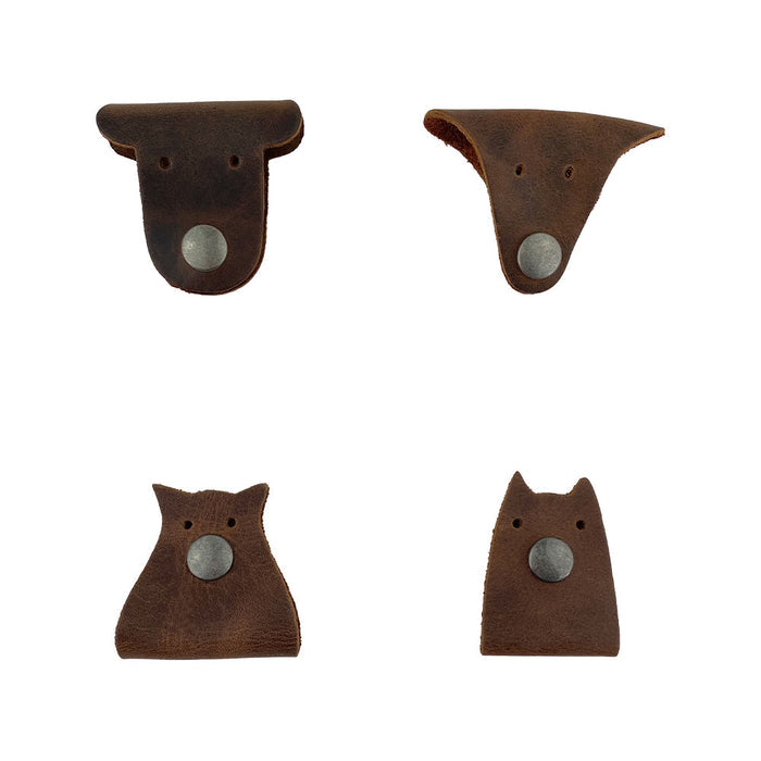 Furry Friends Cord Keeper (4-Pack), showcasing unique designs for managing cords, crafted from durable full grain leather by Hide & Drink, perfect for keeping cables tidy. Furry Friends 4-Pack Cord Keeper (Cord Clam), Full Grain Leather, StockyardX, Small Batch Production, Hand Cut, Hand Sewn, Fire Branded, Artisan, Handmade in La Antigua Guatemala & Oaxaca Mexico.